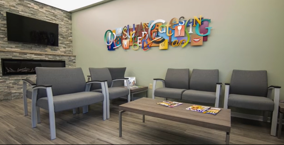 Inside view of Lansing office with beautiful art sign on the wall